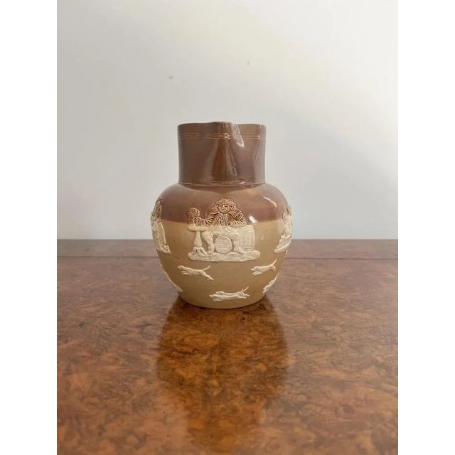 Antique Victorian Doulton Lambeth harvest jug having an antique Doulton Lambeth harvest jug decorated with hunting scenes...