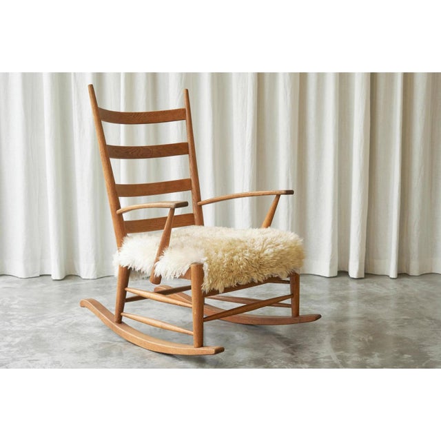 Rocking Chair in Solid Oak and Sheepskin, France 1960s. Sit down and relax and enjoy your book, a warm cup of tea or a...