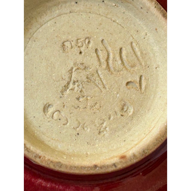Chinese monochrome brick -red glazed ceramic vessel, designed with a squat, globular body and two small loop or lug...