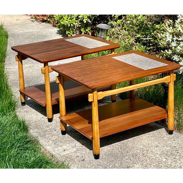 Offered is a pair of Monte Carlo end tables designed by Andrew Bus for Lane. Crafted of walnut veneers and oak the tables...