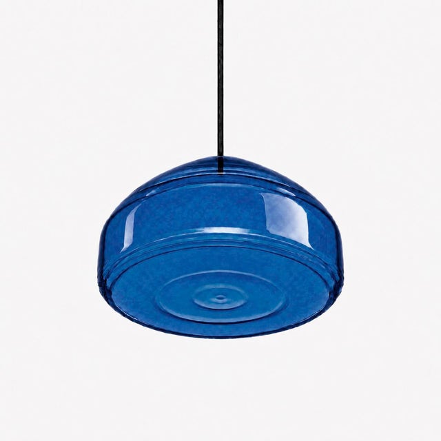 Crafted with high visual clarity, this modern pendant lamp features a sleek silhouette hand-blown from premium glass in a...