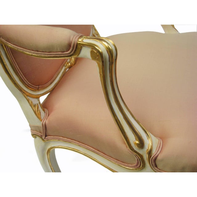 A fine pair of Louis XV first revival armchairs. Polychromed in Ivory with fine gilt carved details. Full professional...