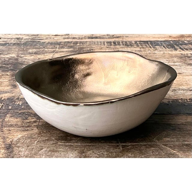 This exquisite slab-built studio pottery bowl is a masterclass in organic modernism, showcasing a harmonious blend of raw...