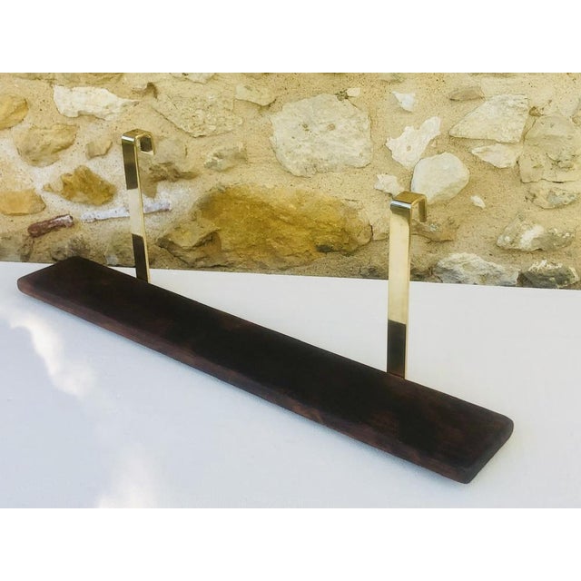 Vintage, hanging wall shelf circa 70's/ 80's. The shelf is made of beech wood with a walnut finish. The hanging/ support...