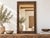 A striking example of architectural salvage repurposed as a grand mirror. The wide frame is clad in antique pressed tin...