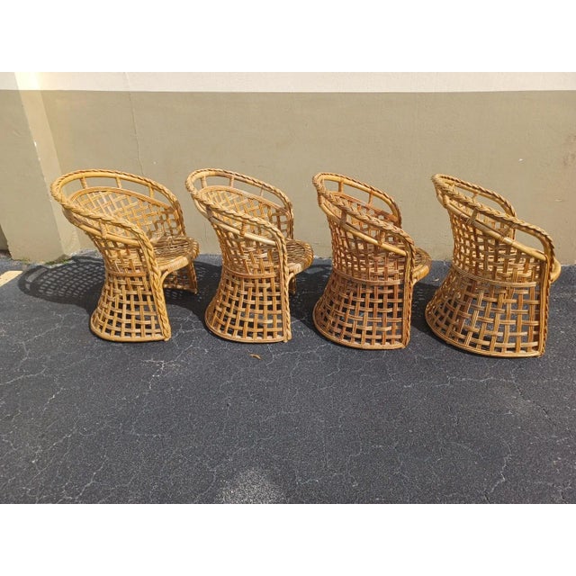 Vintage boho set of 4 rattan branded and weaved barrel dining chairs. Matching table base with glass listed seperately