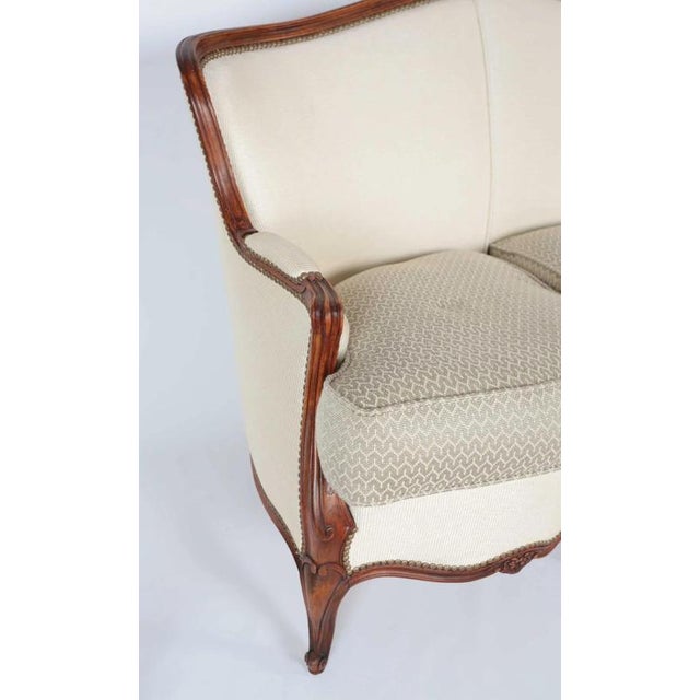 Luxurious sofa made of solid oak stained in walnut brown. Newly upholstered in Leliévre á Paris - one of the most...