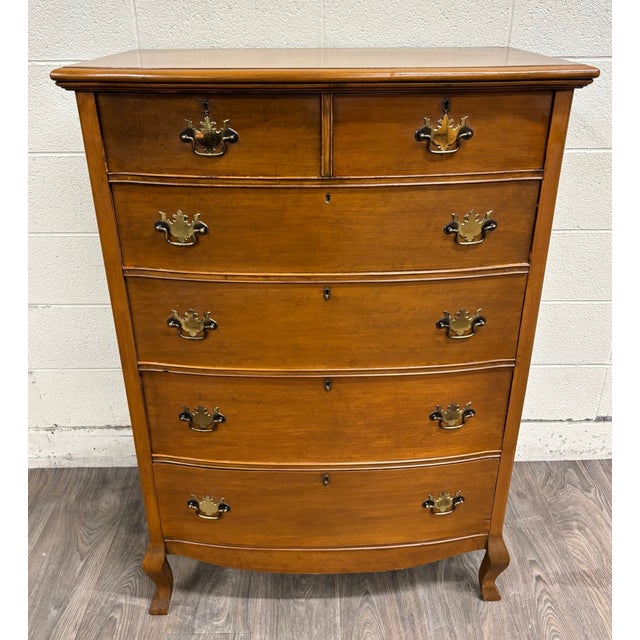 This is a beautiful antique American Federal bowfront chest of drawers with Chippendale and Hepplewhite influences, likely...