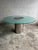 Round glass dining table with fixed central plate – industrial modern, 1990s a bold and elegant round dining table with a...