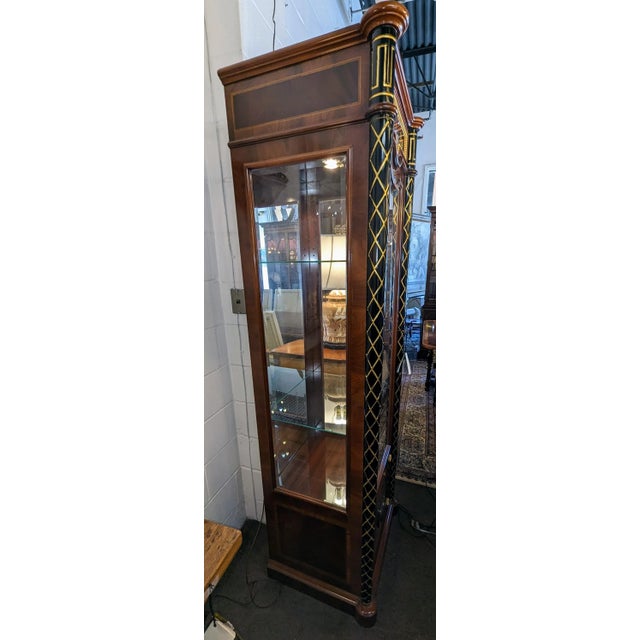 High quality Regency Style curio cabinet. Flame mahogany with olive wood burlwood and marquetry inlays. Painted gold...