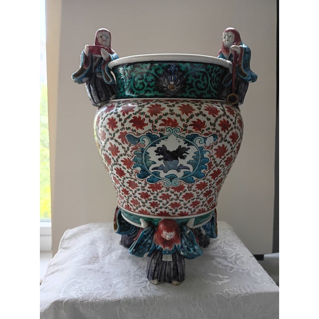 This is a magnificent and highly unusual open-top Asian style porcelain centerpiece bowl, defined by its incredible...