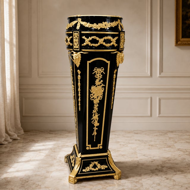 Make a bold statement with this luxurious oversized wood pedestal, exquisitely crafted with intricate gold leaf detailing,...