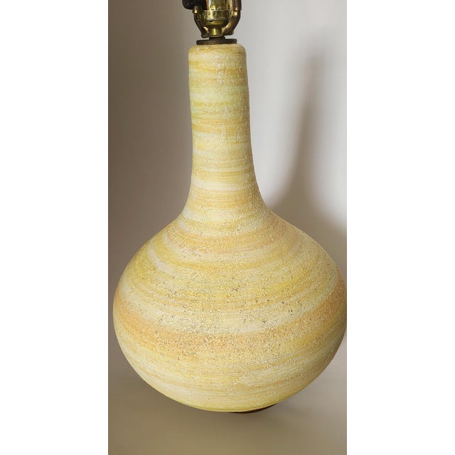 This weighty gourd of cream, yellow and sherbet orange is a complement to the room that everyone gravitates to. Though its...