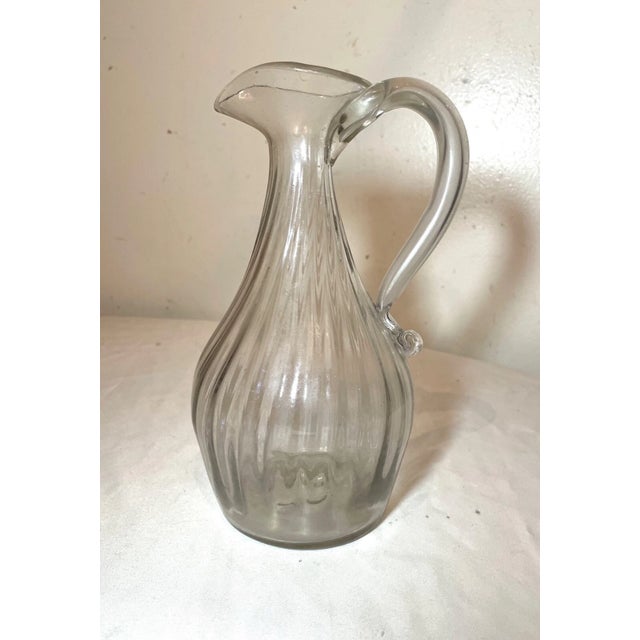 Up for sale is a very rare antique 18th century hand blown Spanish glass ewer. The ewer is blown with a lovely ribbed...
