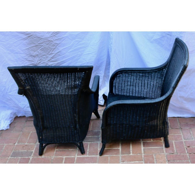 Wicker Patio Chairs Black - A Pair. The wicker chairs came from a farm house which was being renovated. The wicker is in...