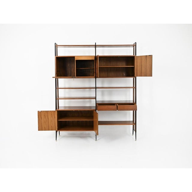Modular bookcase comprising 5 shelves, 2 cabinets with 2 doors each containing one shelf, and a cabinet with 2 drawers and...