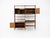 Modular bookcase comprising 5 shelves, 2 cabinets with 2 doors each containing one shelf, and a cabinet with 2 drawers and...