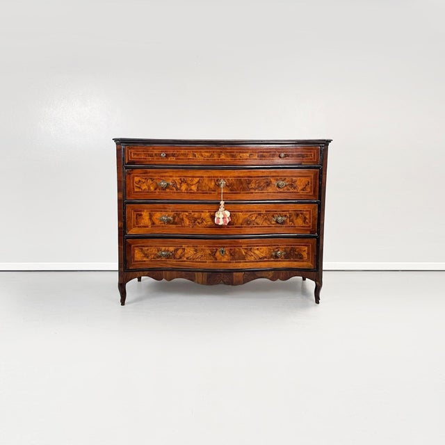 Italian baroque chests of drawers in wood and metal, 1730-1740s Finely worked sideboard in light and dark wood. The sides...