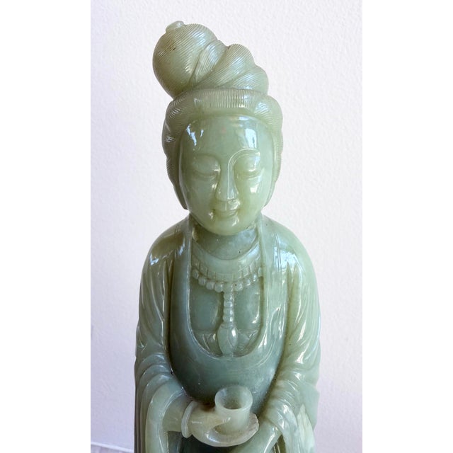 This is a beautiful Antique Chinese Nephrite Jade Guanyin / Kwan Yin Figurine with hand carved rosewood stand. Circa 1900,...