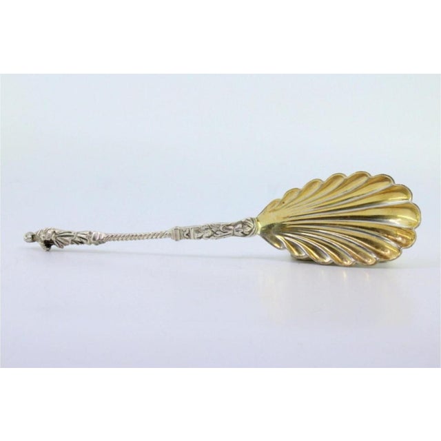 Gold-Plated Silver Fruit Spoon with Twisted Handle and Pious Lady, in Very Good conditions. Designed 1890 to 1919 This...
