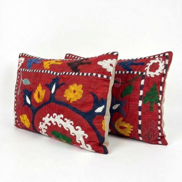 This beautiful 16'' x 24'' hand-embroidered Suzani pillow cover set was made from authentic Uzbek cotton fabric. The...