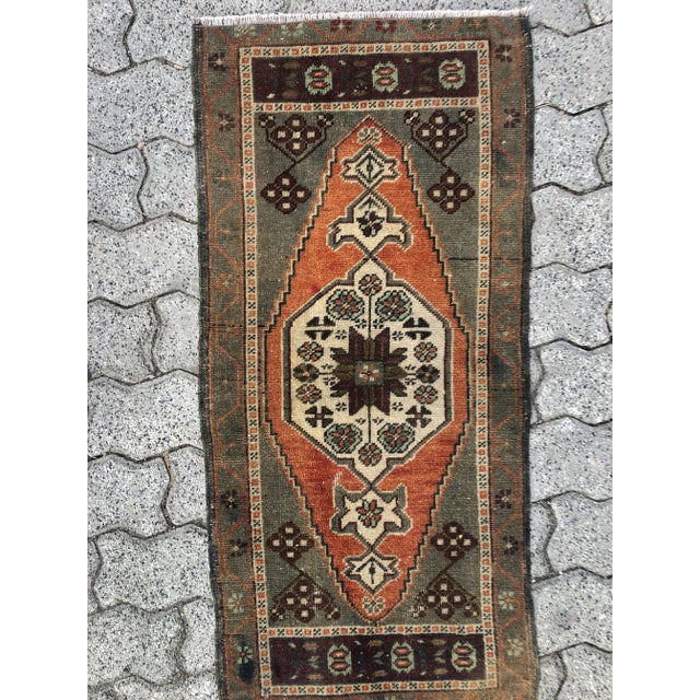 This is a vintage Turkish Oushak rug from the 1960s. The piece was hand-knotted.