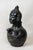 This exquisite mangbetu bust vase is a striking marriage of functional pottery and sculptural artistry, originating from...