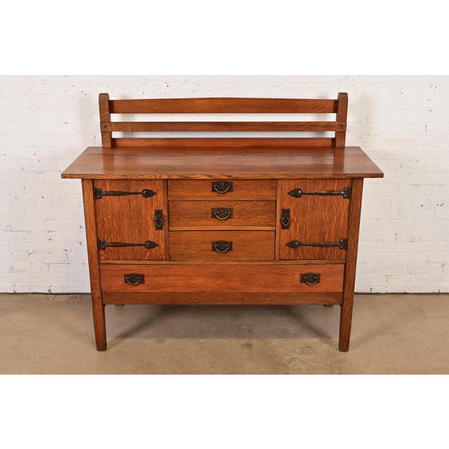 An exceptional antique Mission or Arts & Crafts period strap hinge sideboard, buffet server, or bar cabinet with plate...