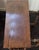 This handsome antique-style wooden side table features an elegant, narrow silhouette with richly detailed turned legs and...