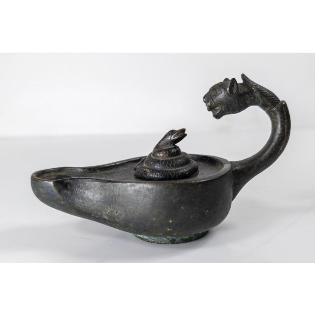 We are selling this cool decorative 20th century bronze oil lamp. This oil lamp is done in the Hellenistic Greek or Roman...