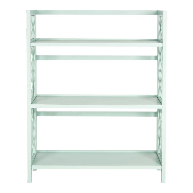 Organize in style with the distinctive low bookcase crafted of solid elm wood with a pretty celadon finish.Whether used...