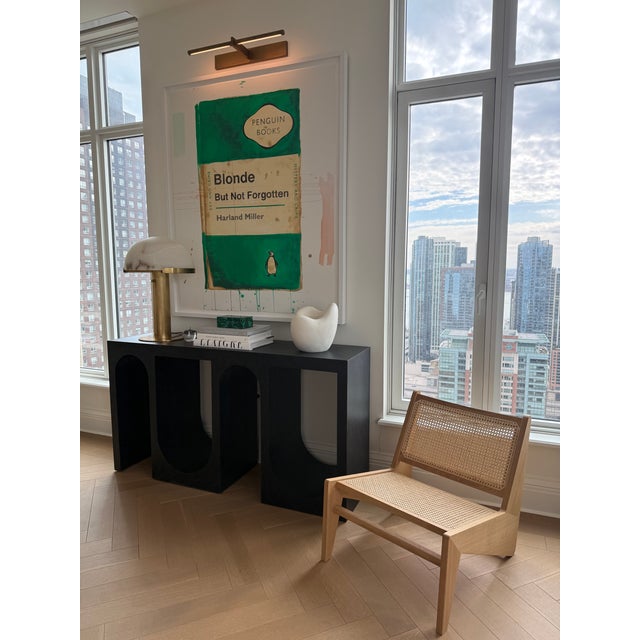 The Kangaroo Chair designed by Pierre Jeanneret, purchased from Design Within Reach and produced by Cassina. This chair's...