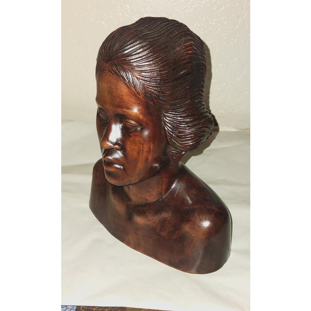 The product is a vintage hand-carved Balinese teak bust sculpture by artist Fatimah Damek, signed by the artist. This...