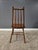 This mid-to-late 20th-century spindle back Windsor chair is a sturdy example of American Colonial Revival design. Features...