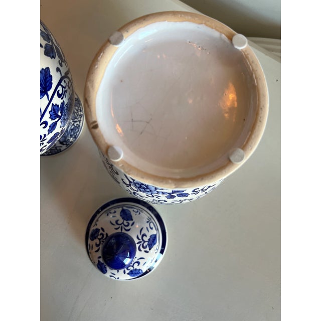 Blue and White Pair of Ginger Jars comes in a Traditional Pattern sure to add a nice Touch to any room .