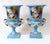 A magnificent pair of French Sèvres-style porcelain urns with a striking turquoise-blue ground Each urn features a finely...