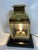 Early twentieth century highly polished and lacquered ships cabin lantern with three beveled glass panels, back reflector...