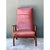 This vintage lounge chair is a tall, sculptural seat with a sleek high back and a low, generous cushion, upholstered in...