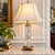 A striking mid-20th-century signed Dresden cut crystal and brass table lamp, featuring a substantial cylindrical crystal...