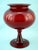 A fabulous scarlet red glass vase, crafted from the finest blown glass, with a voluminous belly culminating in an equally...