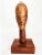Offered is a vintage hand carved table sculpture of an African tribal head. The head has a very elongated projection...