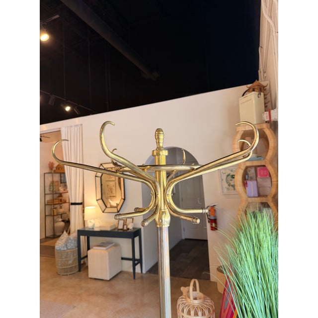 Elevate your entryway, office, or bedroom with this sophisticated traditional-meets-transitional brass coat rack. Crafted...
