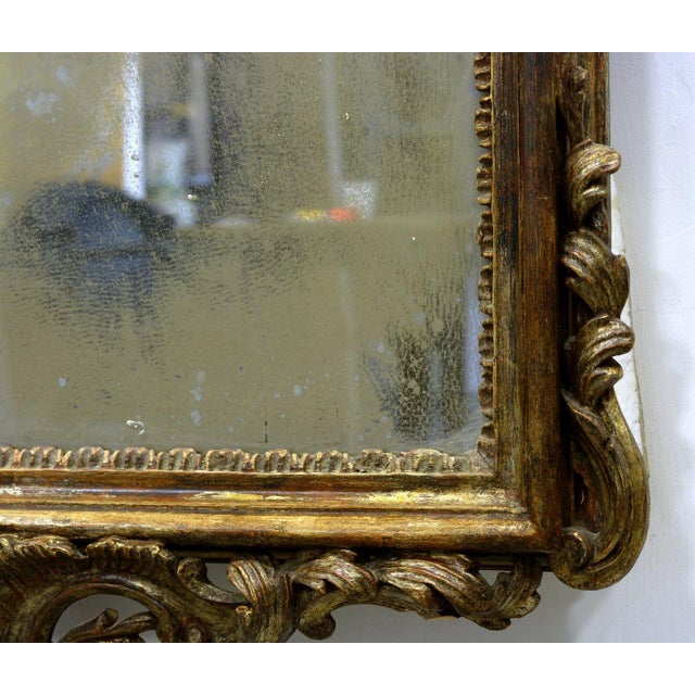 This elegant antique wall mirror was made in Naples in the late 19th century in the Louis XV style. The richly carved...