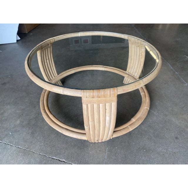 Mid-century Five-strand rattan 2-coffee table The unusual round base's circular form is echoed throughout the piece with...