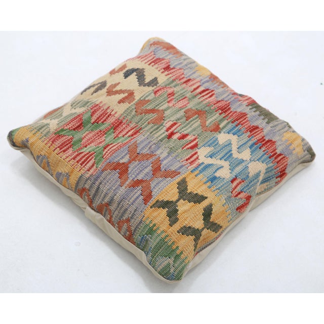 A one-of-a-kind handwoven Afghan wool kilim accent pillow featuring mixed-motif patchwork. Cut and sewn by hand from a...
