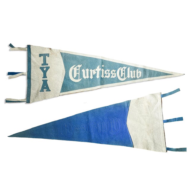 Add a touch of nostalgic charm to your space with this striking wool felt pennant, a true relic from the 1910s. Featuring...