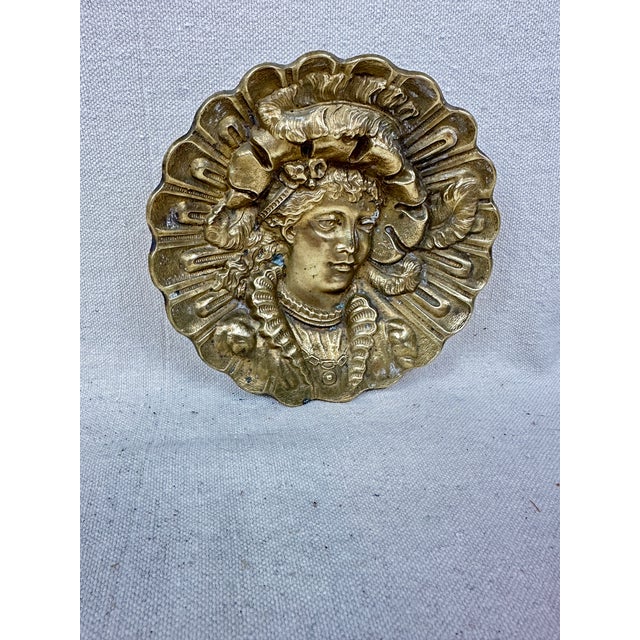 Vintage brass catchall/ashtray depicting a relief portrait of a young woman. This is a pre-owned item so please see all...