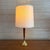 Vintage teak and brass table lamp with a long tapered teak stem and softly patinated brass base. The proportions on this...
