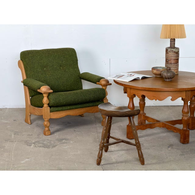 Pair of Danish lounge chairs in solid oak, designed by Henning Kjærnulf, 1960s. Each chair has loose seat and back...