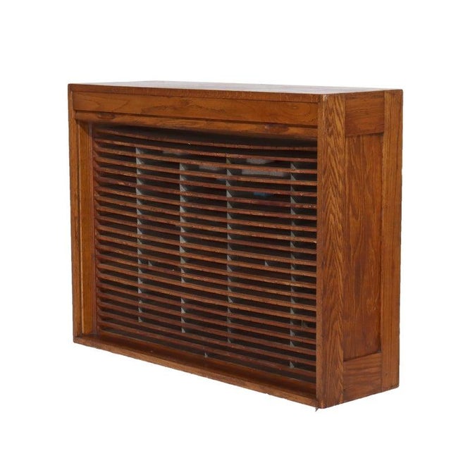 Antique Oak Roll Front Cabinet C1920 Measures - 31.75"H x 41.5"W x 12.25"D An antique oak roll front cabinet from circa...